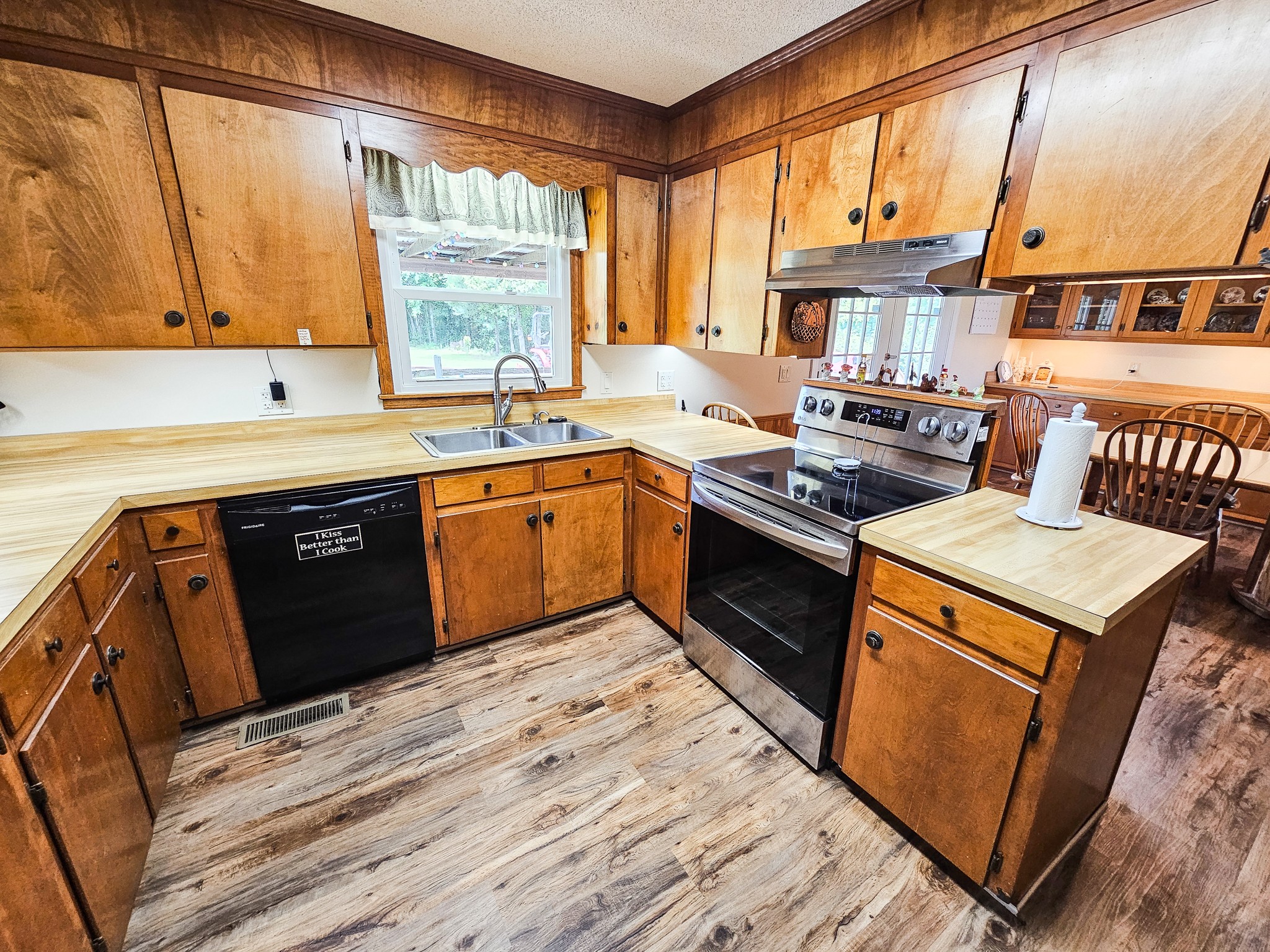 810 Rabbit Branch Road Shelbyville, TN 37160 - Photo 13 of 43 a kitchen with stainless steel appliances granite countertop a stove a sink and a microwave