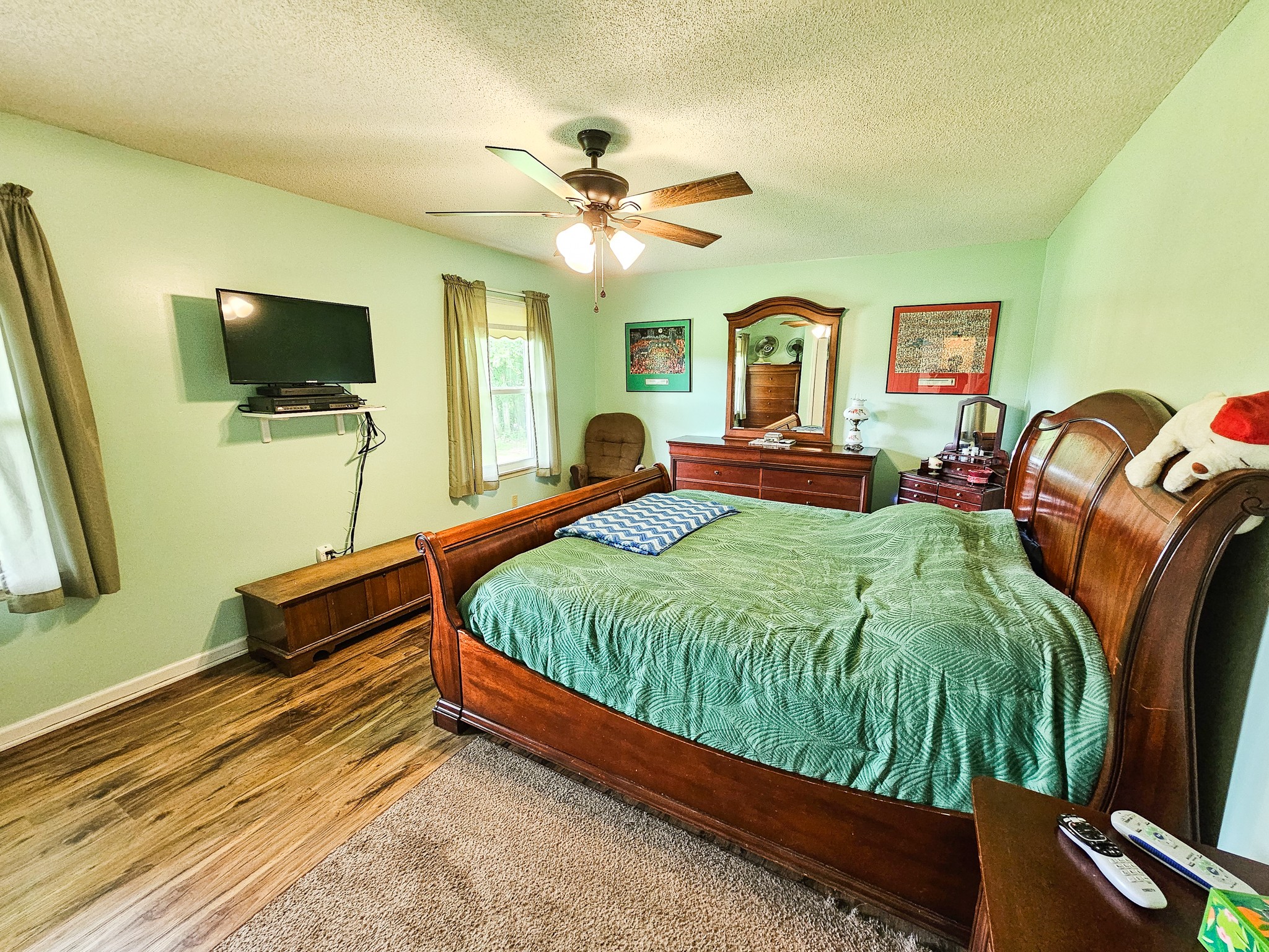 810 Rabbit Branch Road Shelbyville, TN 37160 - Photo 21 of 43 a bedroom with a bed and a flat screen tv