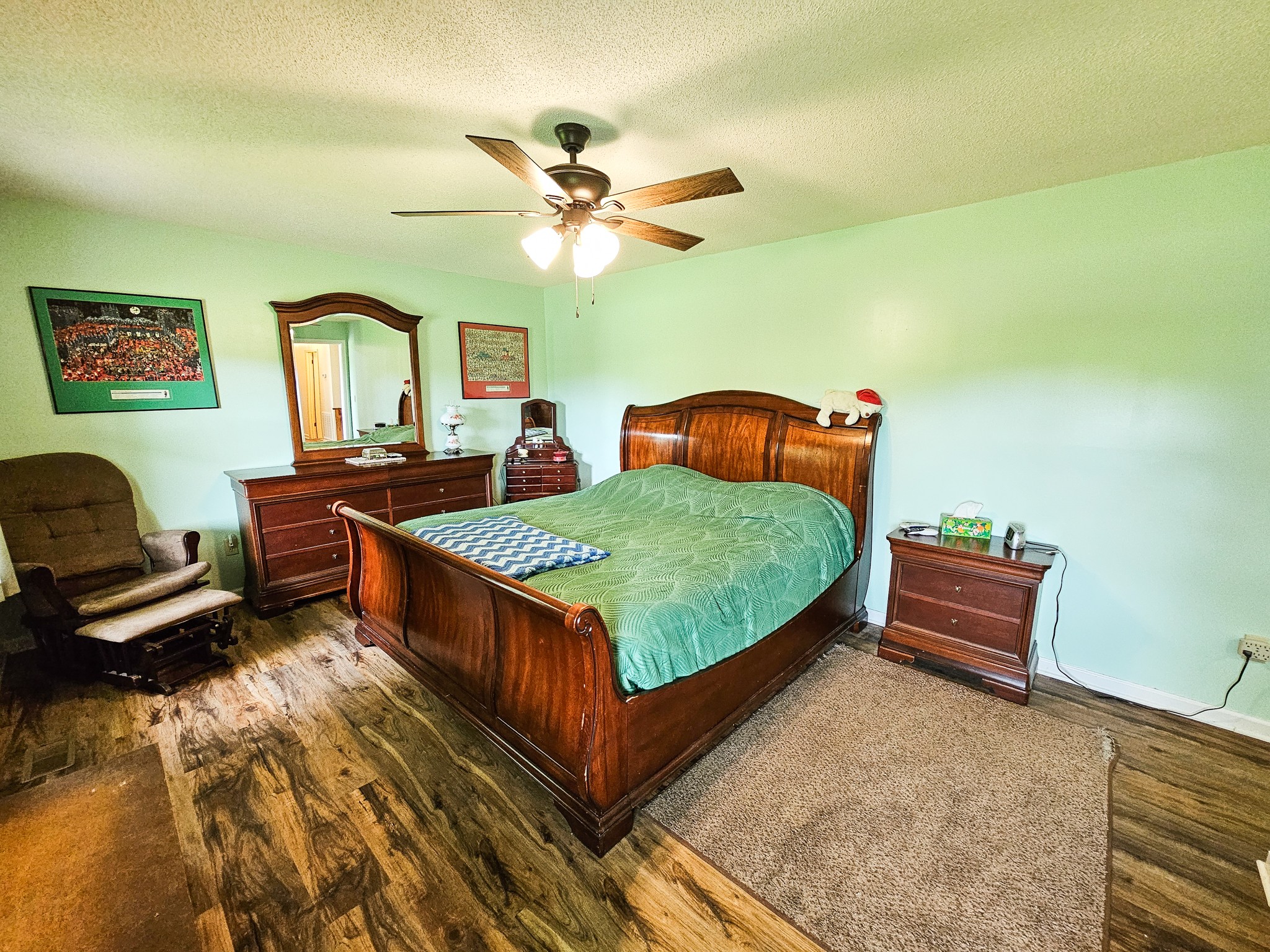 810 Rabbit Branch Road Shelbyville, TN 37160 - Photo 22 of 43 a bedroom with furniture and a chandelier