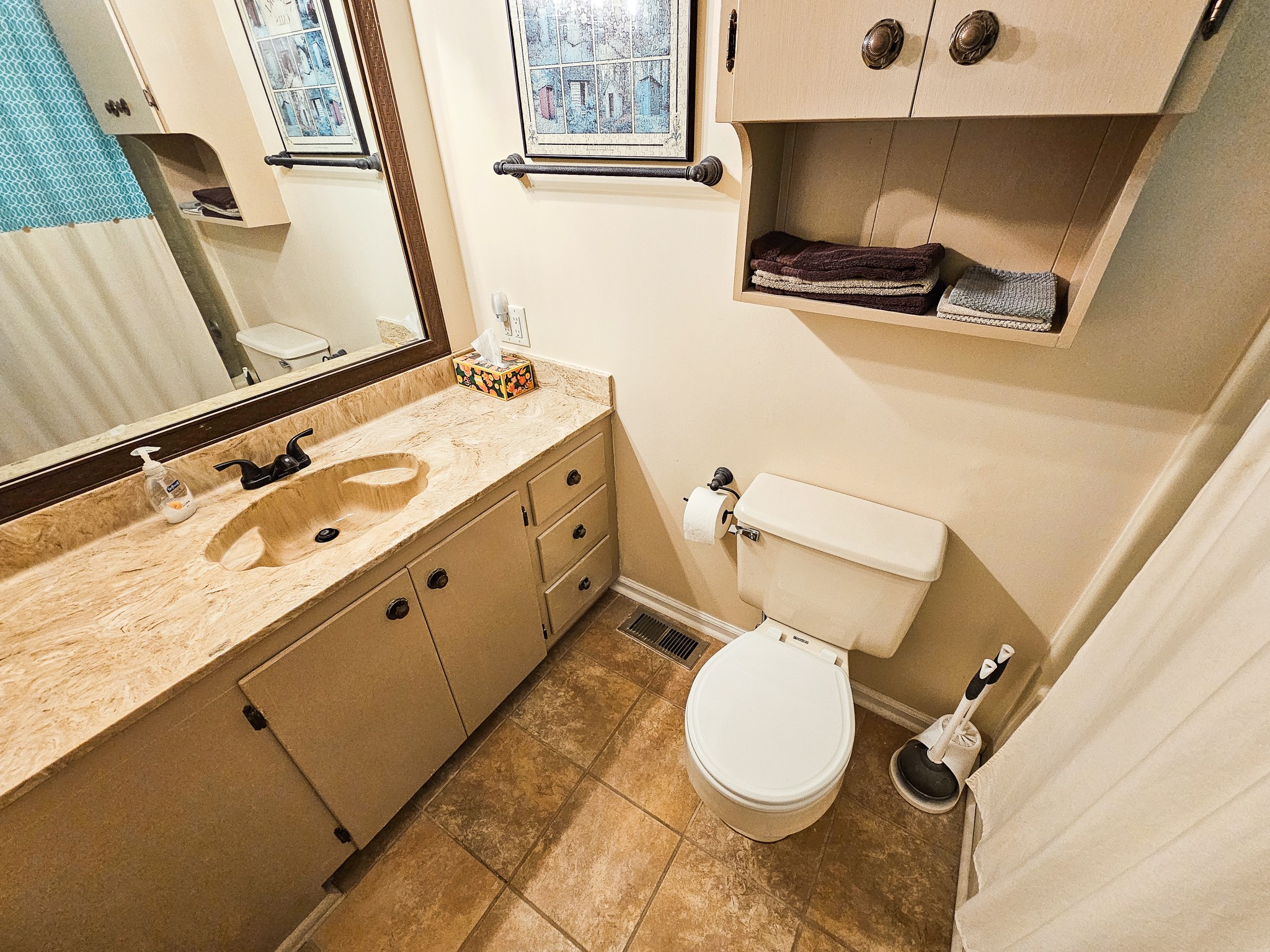810 Rabbit Branch Road Shelbyville, TN 37160 - Photo 23 of 43 a bathroom with a toilet sink and mirror