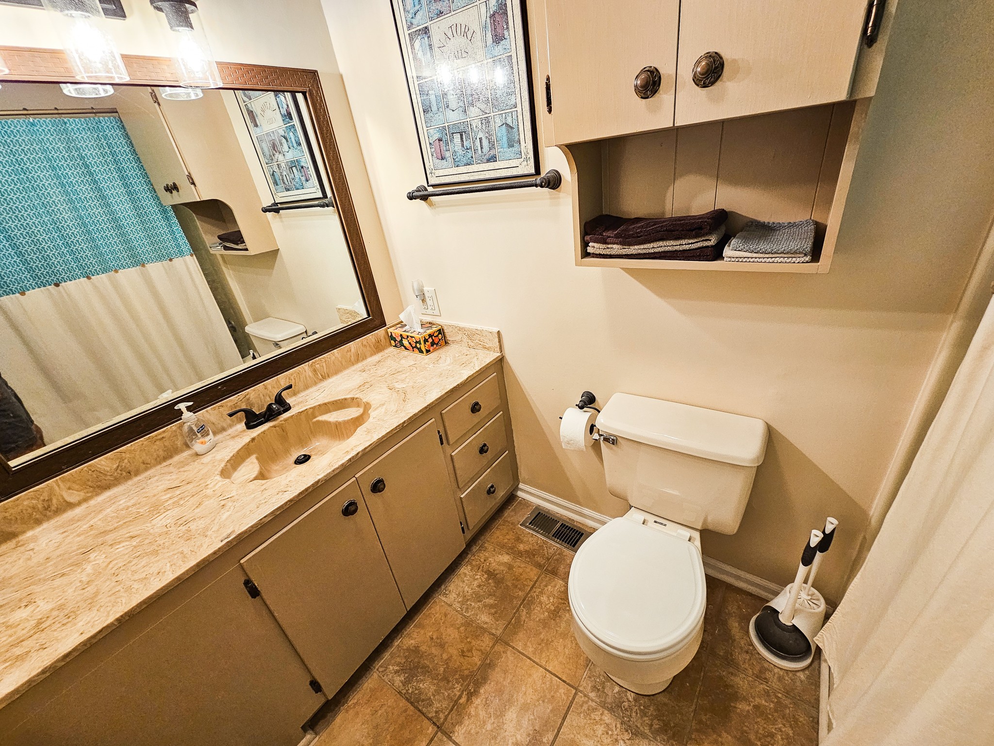 810 Rabbit Branch Road Shelbyville, TN 37160 - Photo 25 of 43 a bathroom with a toilet sink and mirror