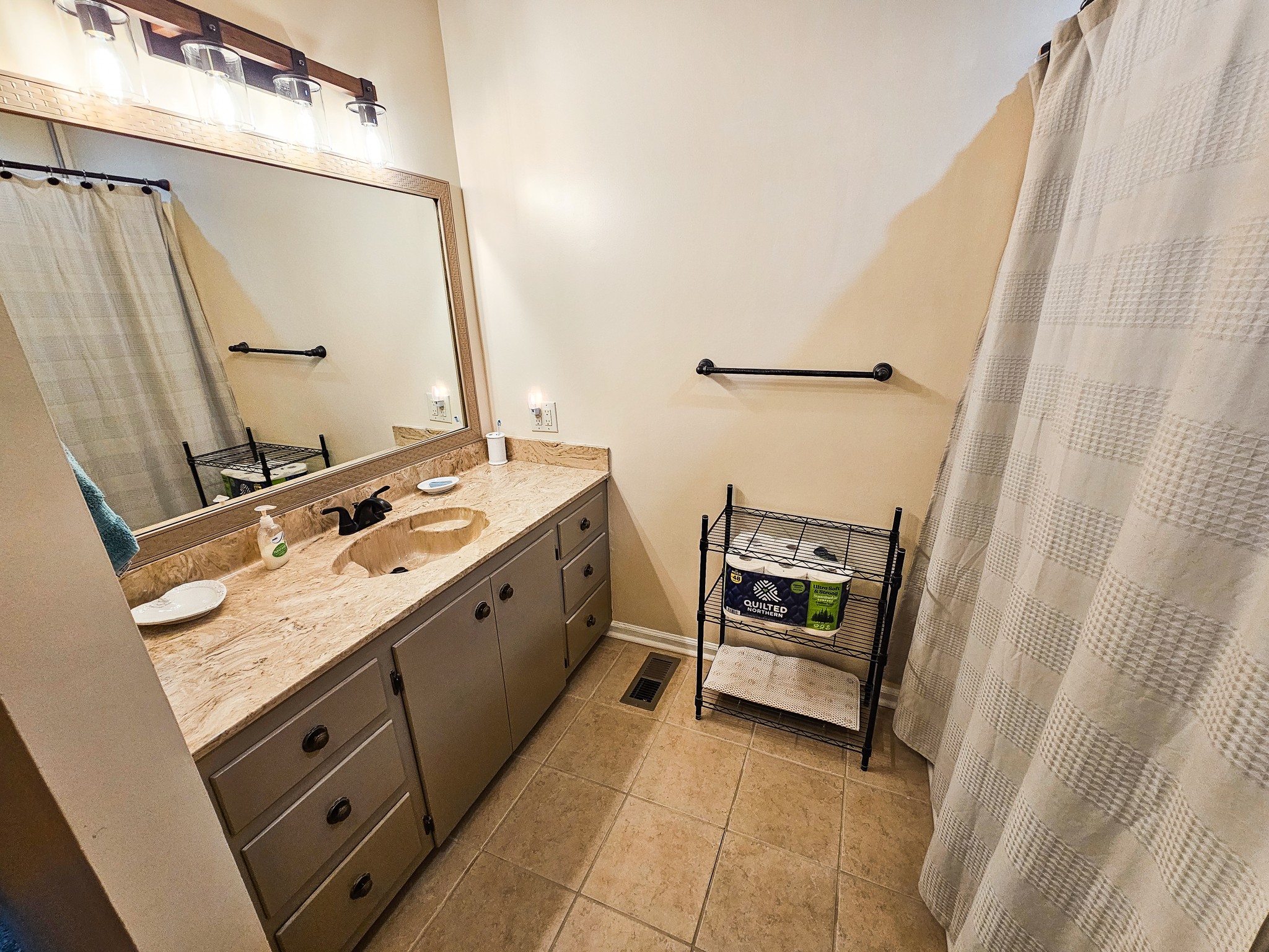 810 Rabbit Branch Road Shelbyville, TN 37160 - Photo 29 of 43 a bathroom with a granite countertop sink and a mirror