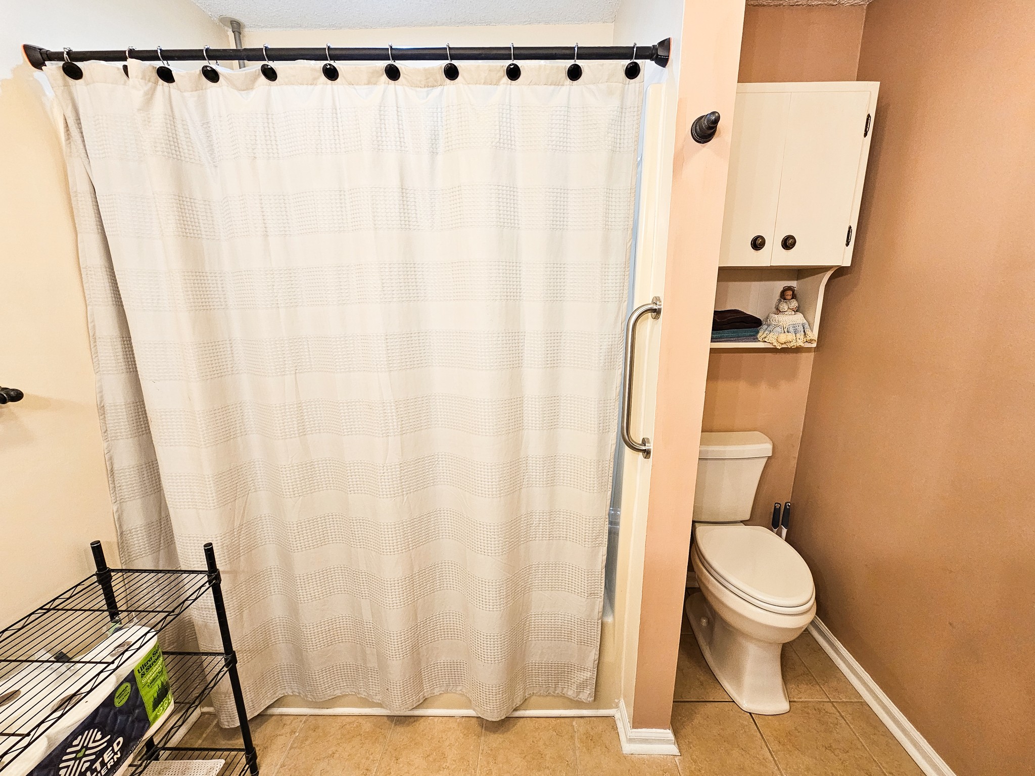 810 Rabbit Branch Road Shelbyville, TN 37160 - Photo 32 of 43 a bathroom with a shower curtain and a sink