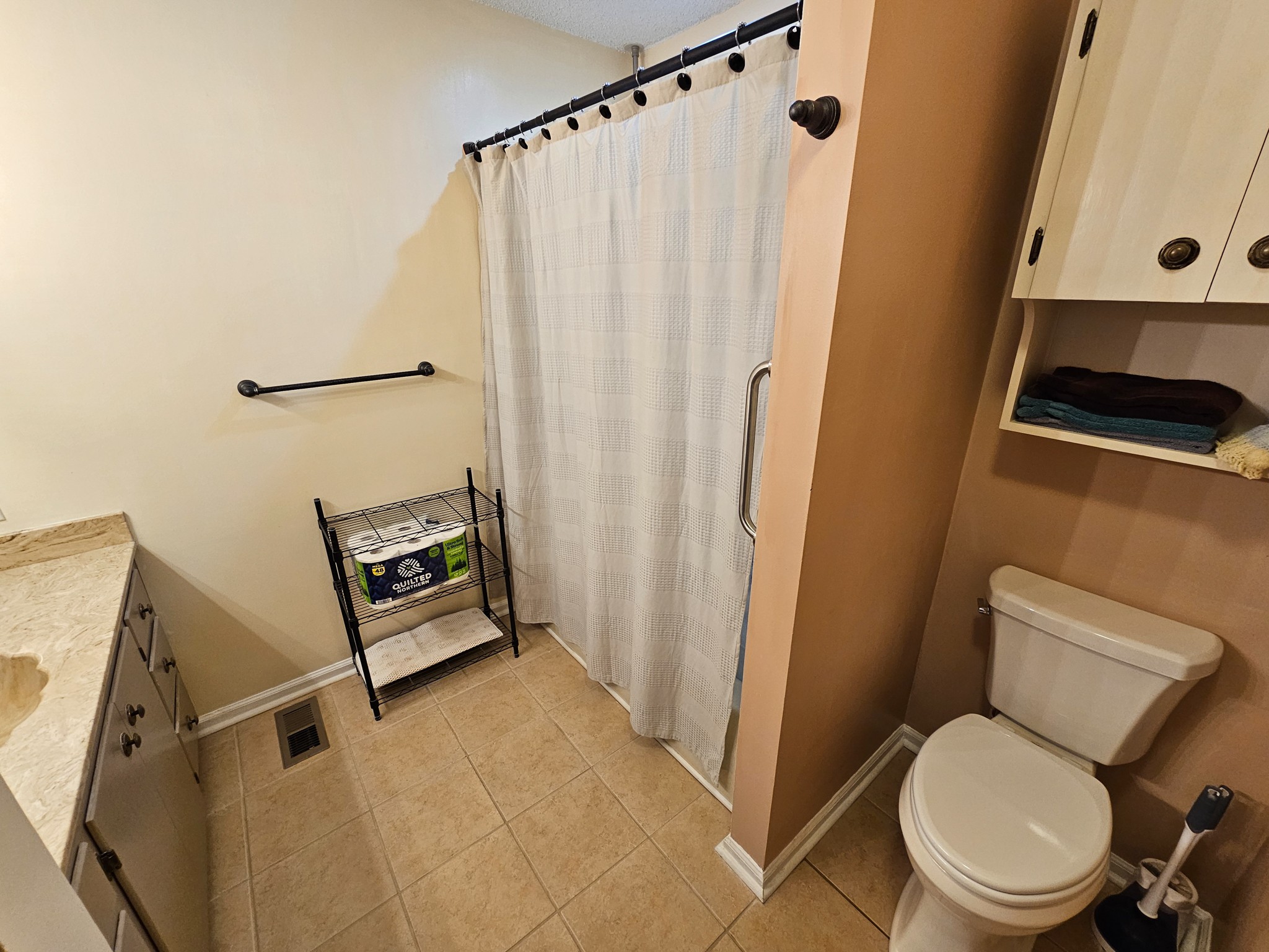 810 Rabbit Branch Road Shelbyville, TN 37160 - Photo 33 of 43 a bathroom with a toilet and a shower curtain