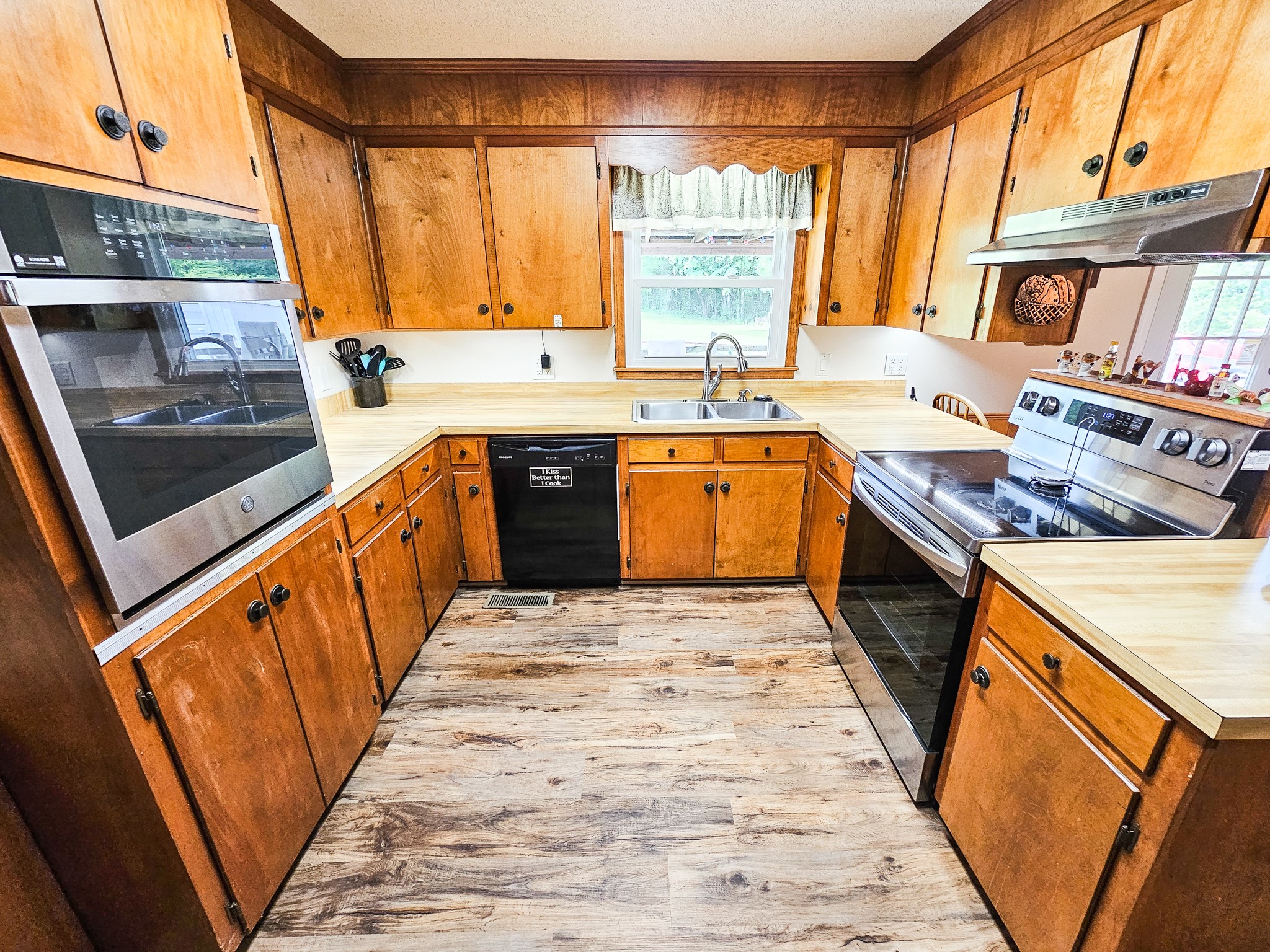810 Rabbit Branch Road Shelbyville, TN 37160 - Photo 10 of 43 a large kitchen with stainless steel appliances granite countertop a stove a sink and a microwave