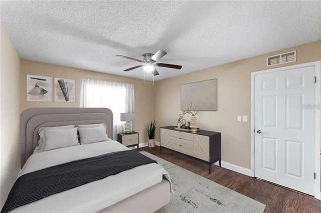 a bedroom with a bed and window