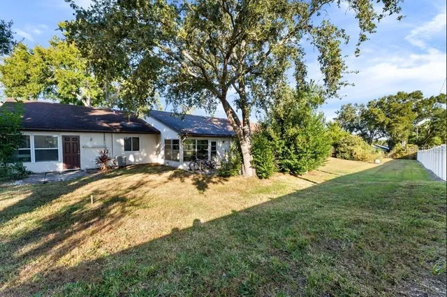 a view of a house with a yard
