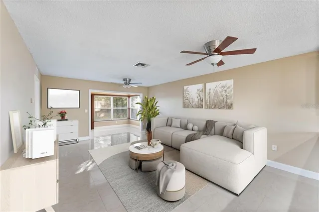 a living room with furniture and a large window