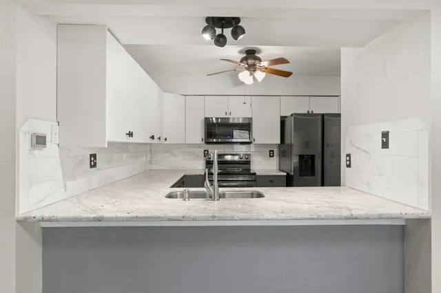 a kitchen with a stove and a microwave