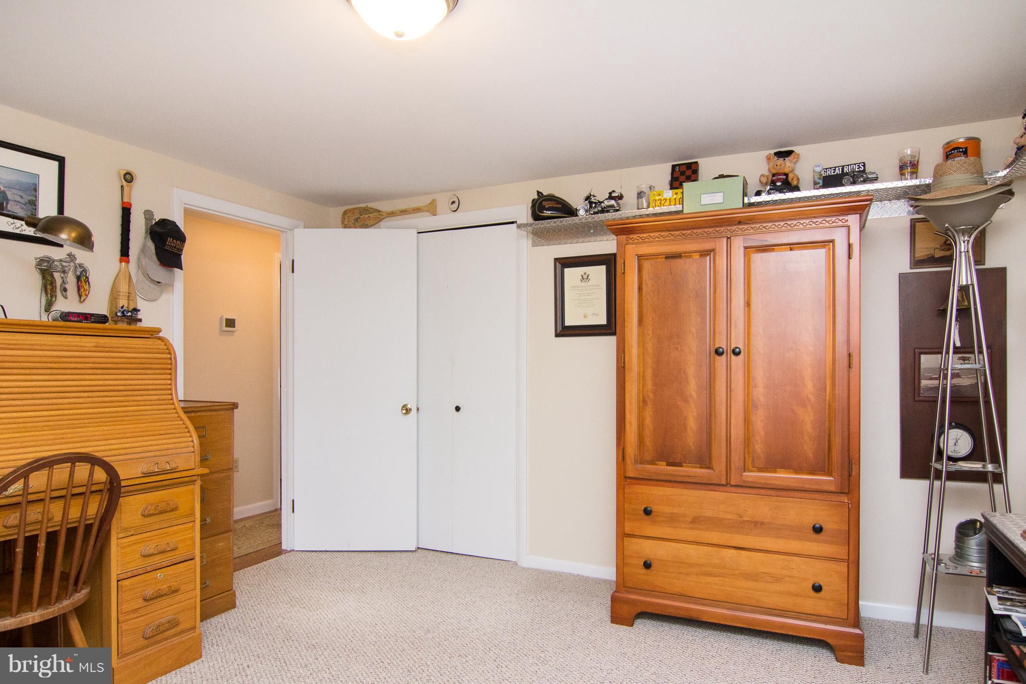 3358 Uniontown Road Westminster, MD 21158 - Photo 24 of 30 a view of walk in closet with clothes and shoes