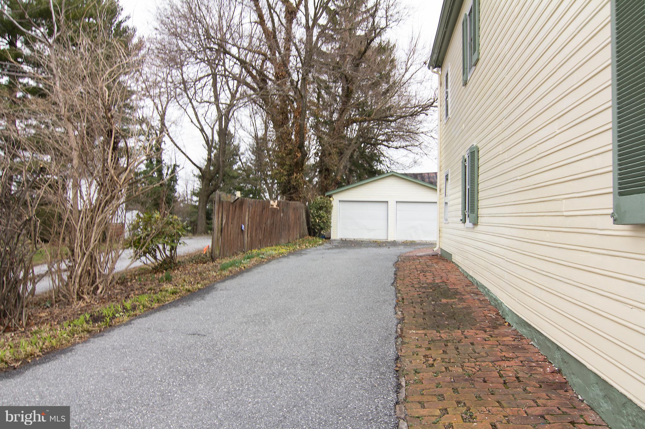 3358 Uniontown Road Westminster, MD 21158 - Photo 26 of 30 a front view of a house with a yard and trees