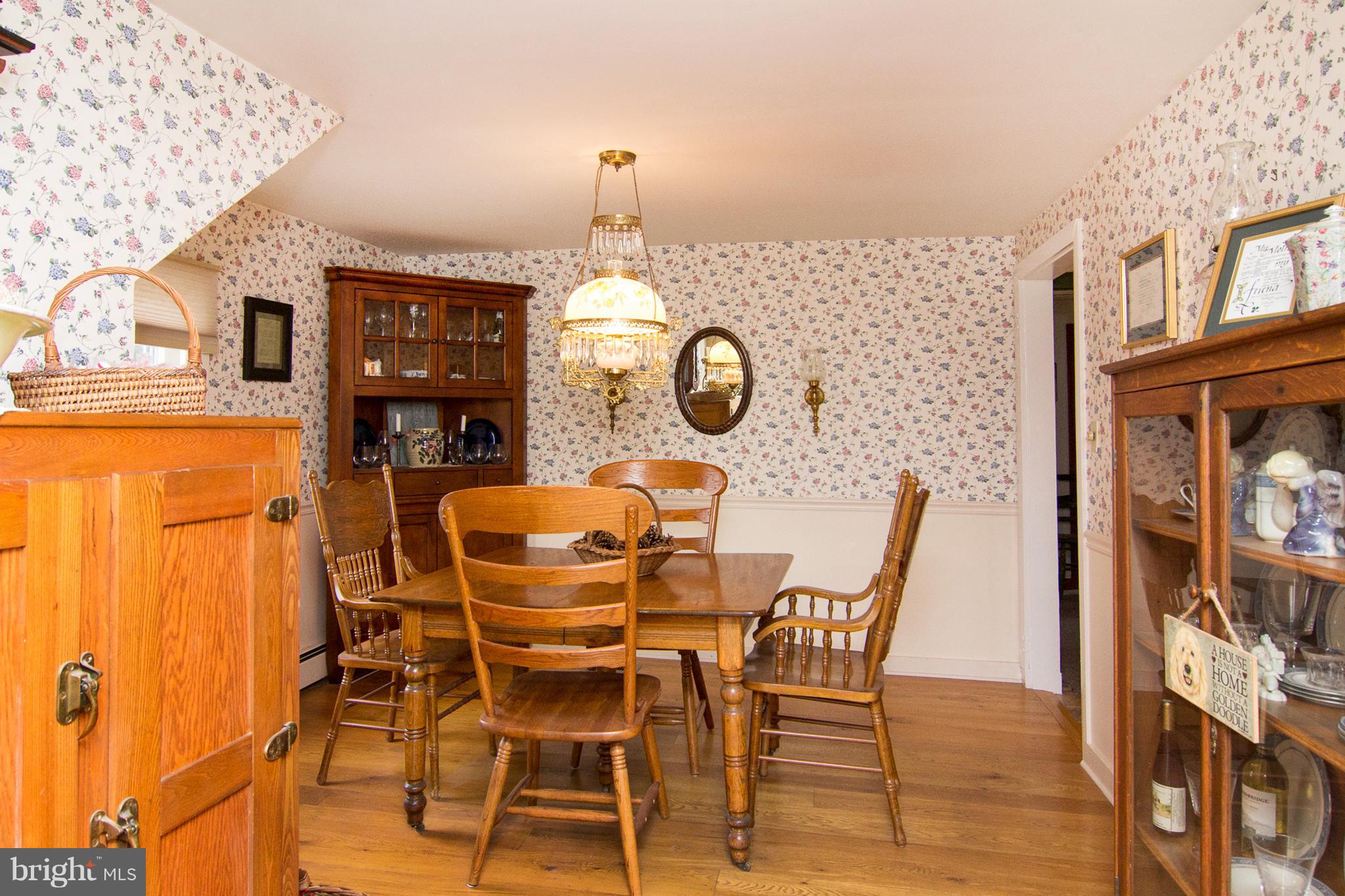 3358 Uniontown Road Westminster, MD 21158 - Photo 6 of 30 a view of a dining room with furniture and wooden floor