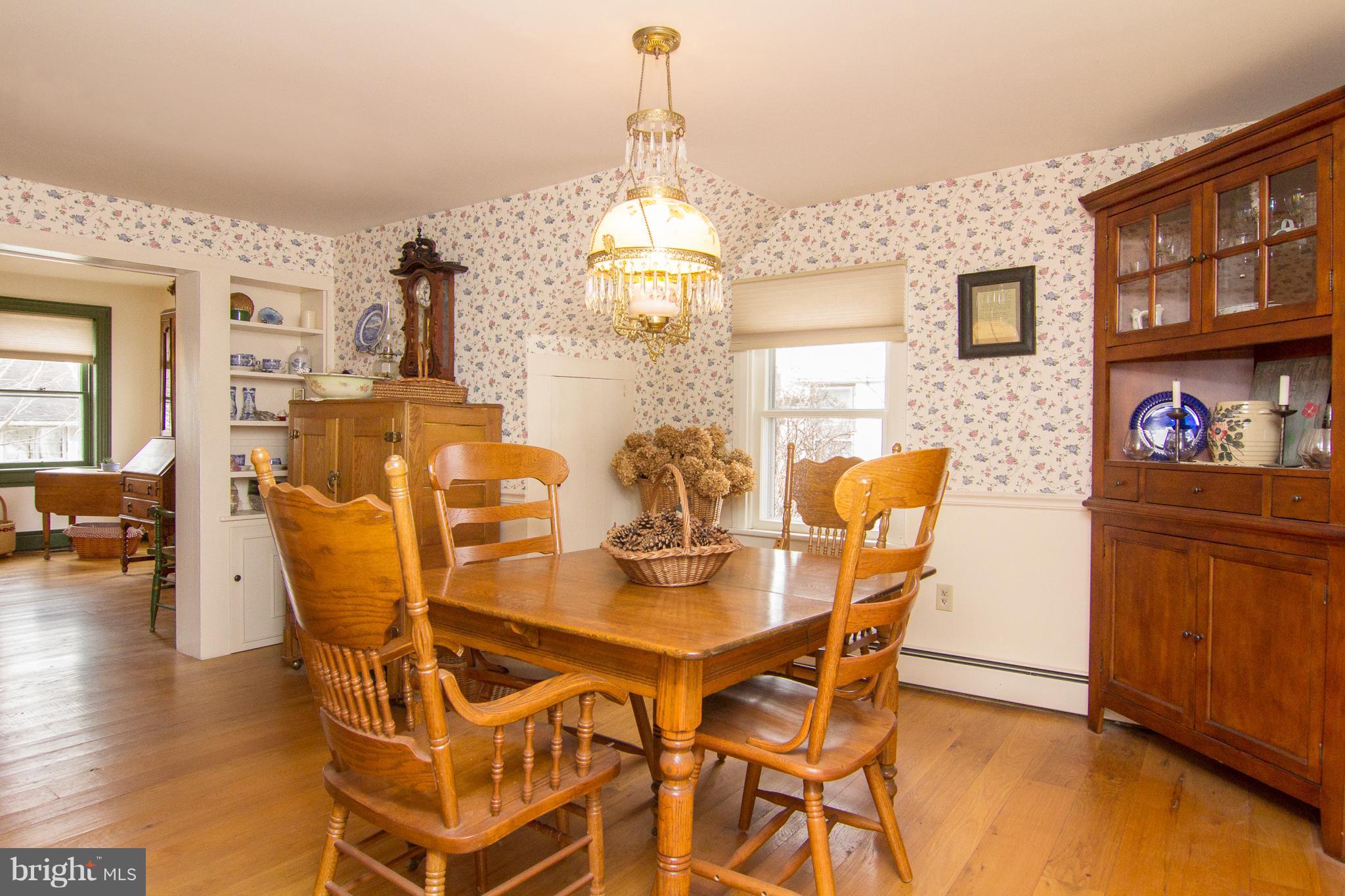 3358 Uniontown Road Westminster, MD 21158 - Photo 7 of 30 a view of a dining room with furniture and chandelier