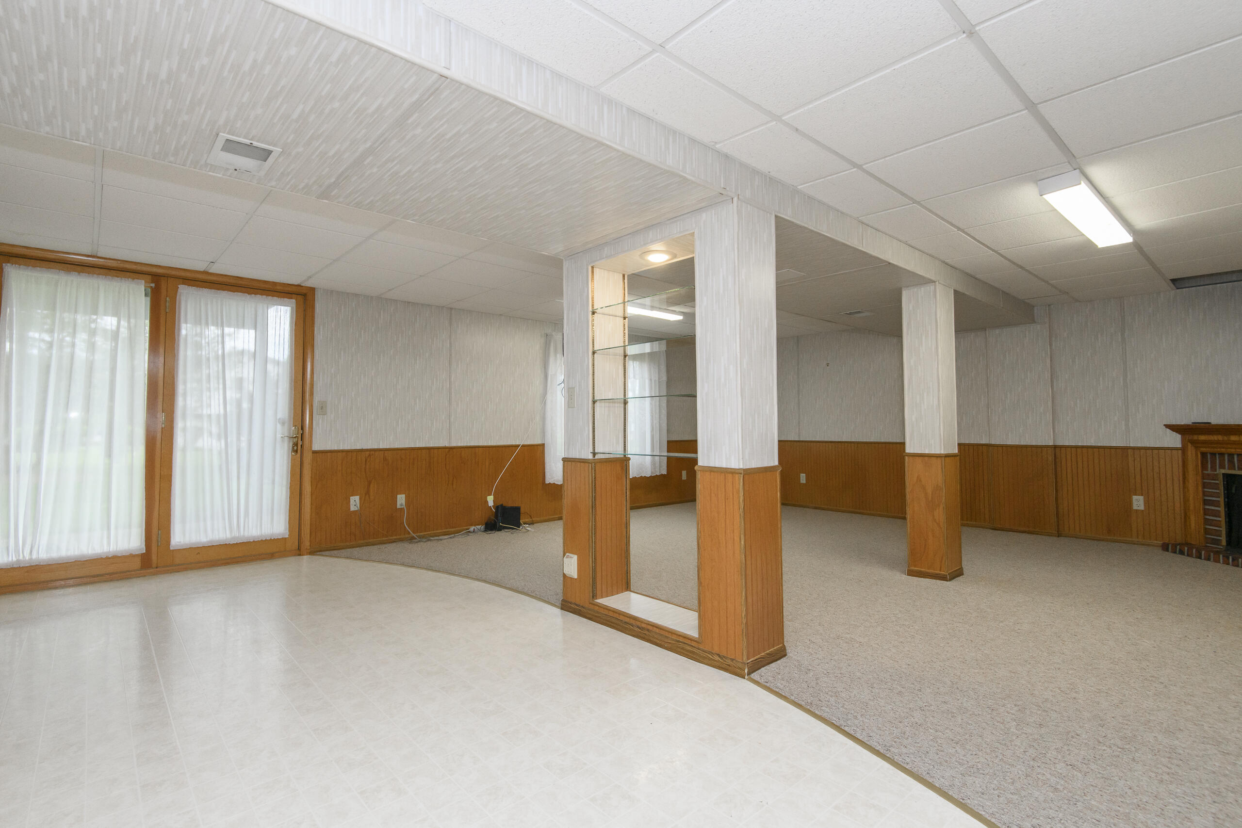 1215 Timber Ridge Pewaukee, WI 53072 - Photo 27 of 42 Family room is filled with natural light
