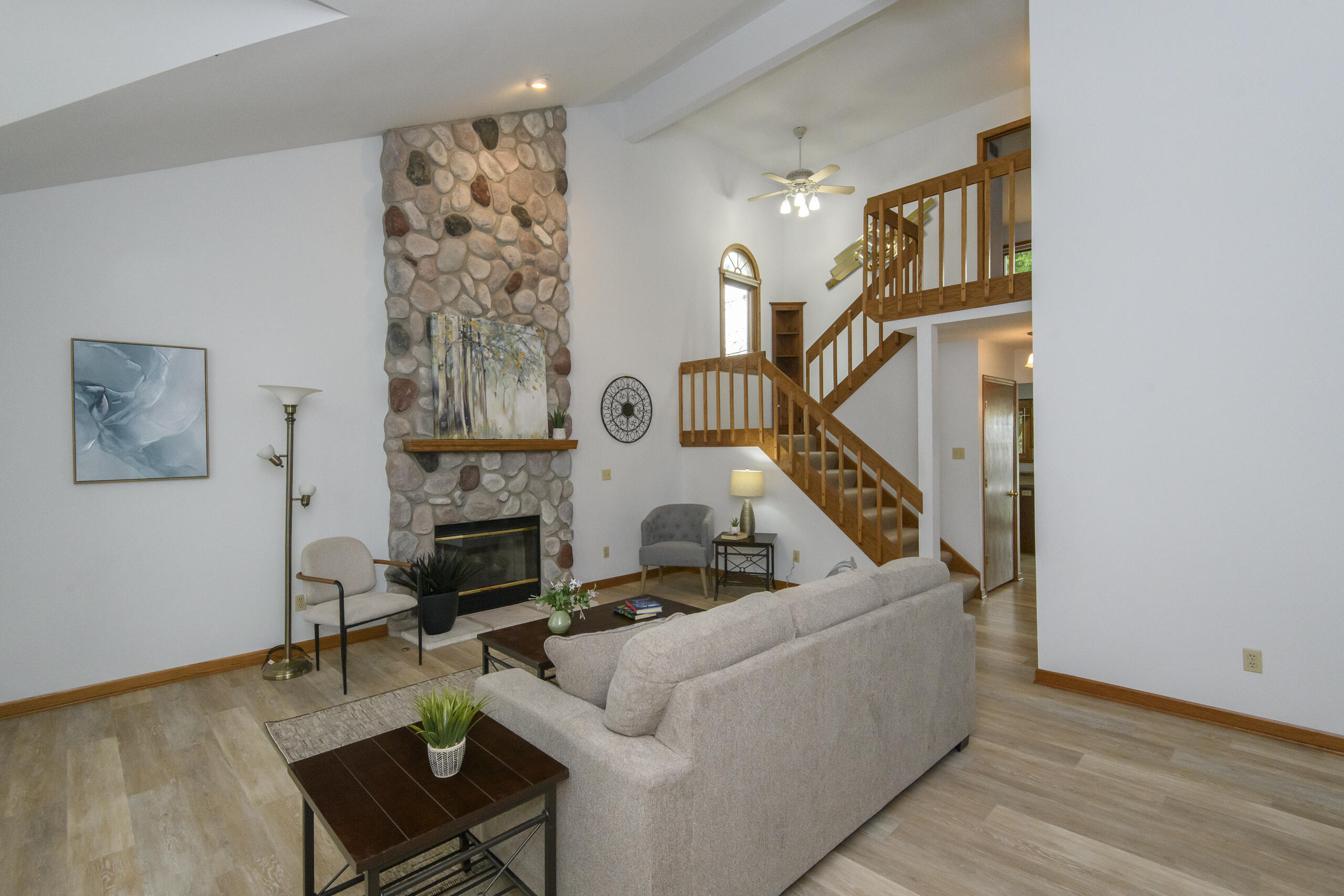 1215 Timber Ridge Pewaukee, WI 53072 - Photo 4 of 42 Floor to ceiling stone fireplace