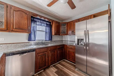 a bathroom with a sink vanity and mirror