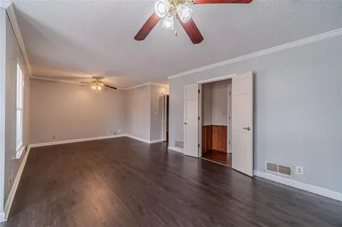 a spacious bathroom with a double vanity sink mirror and toilet