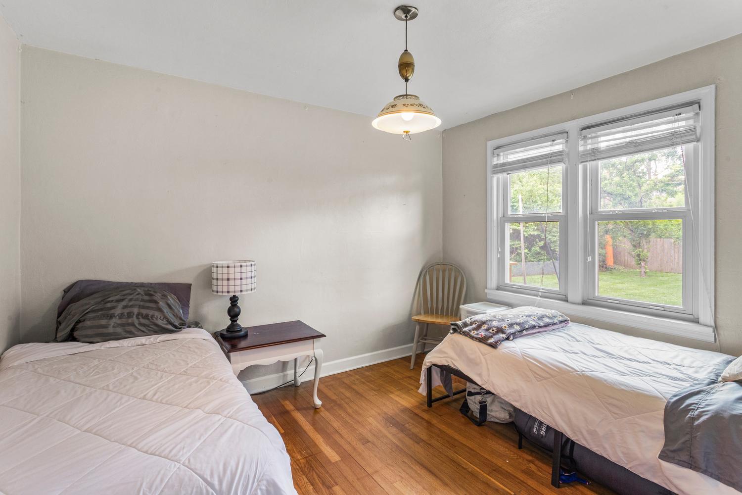1117 West Union Street Champaign, IL 61821 - Photo 21 of 29 a bedroom with a bed and window