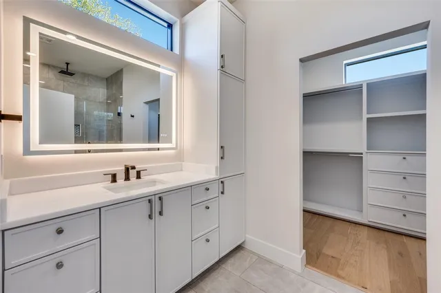 a bathroom with a sink and a mirror