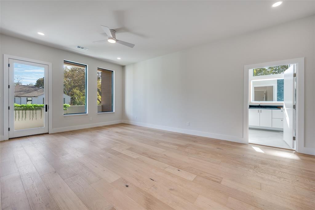 9409 Lenel Place Dallas, TX 75220 - Photo 30 of 36 a view of an empty room with a window and wooden floor