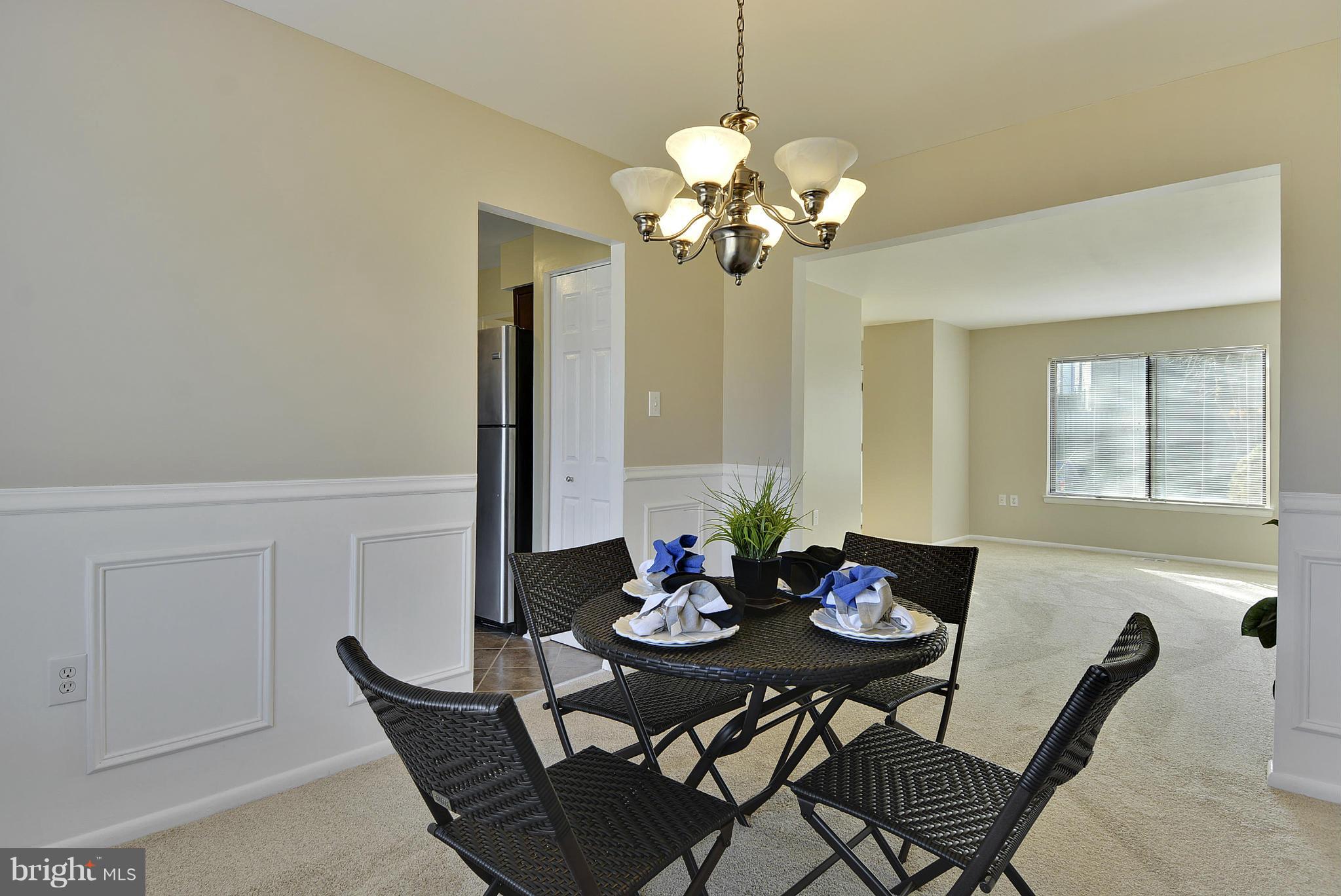 9049 Centerway Road Gaithersburg, MD 20879 - Photo 8 of 30 Dining Room with Updated Chandelier