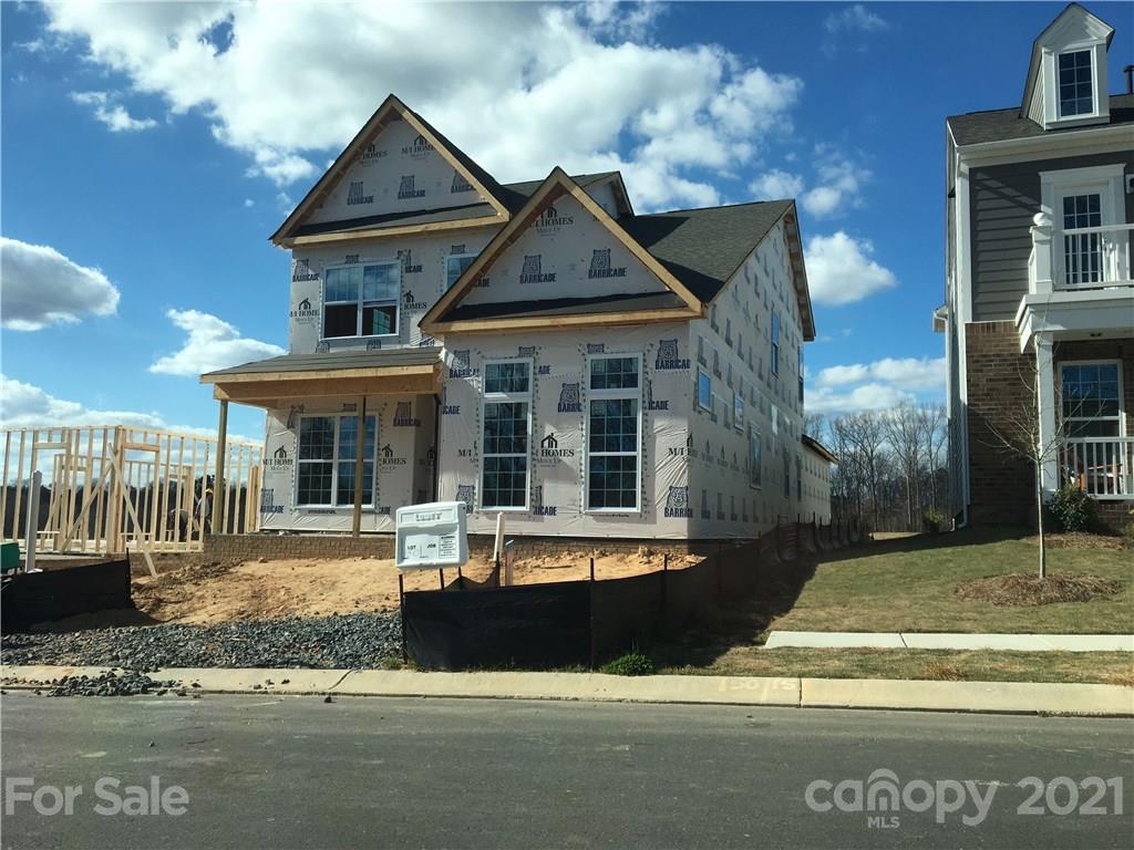 5153 Waterloo Drive, Unit 150 Tega Cay, SC 29708 - Photo 1 of 1 a front view of a house with a yard