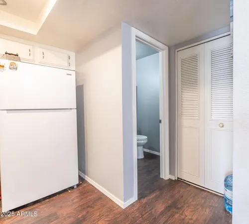 a kitchen with stainless steel appliances granite countertop a sink a stove and cabinets