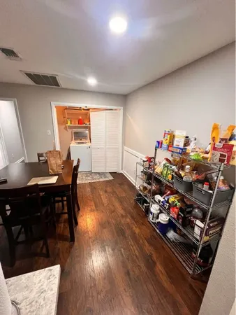 a room with furniture and a wooden floor