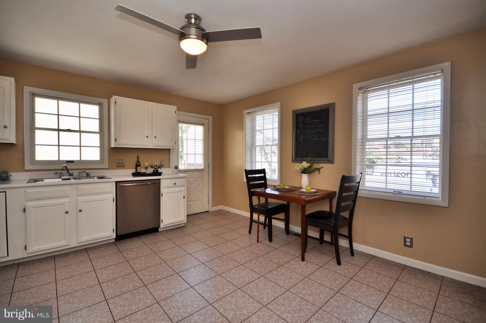 1200 Riverside Avenue Baltimore, MD 21230 - Photo 12 of 30 a view of kitchen with sink dining table and chairs