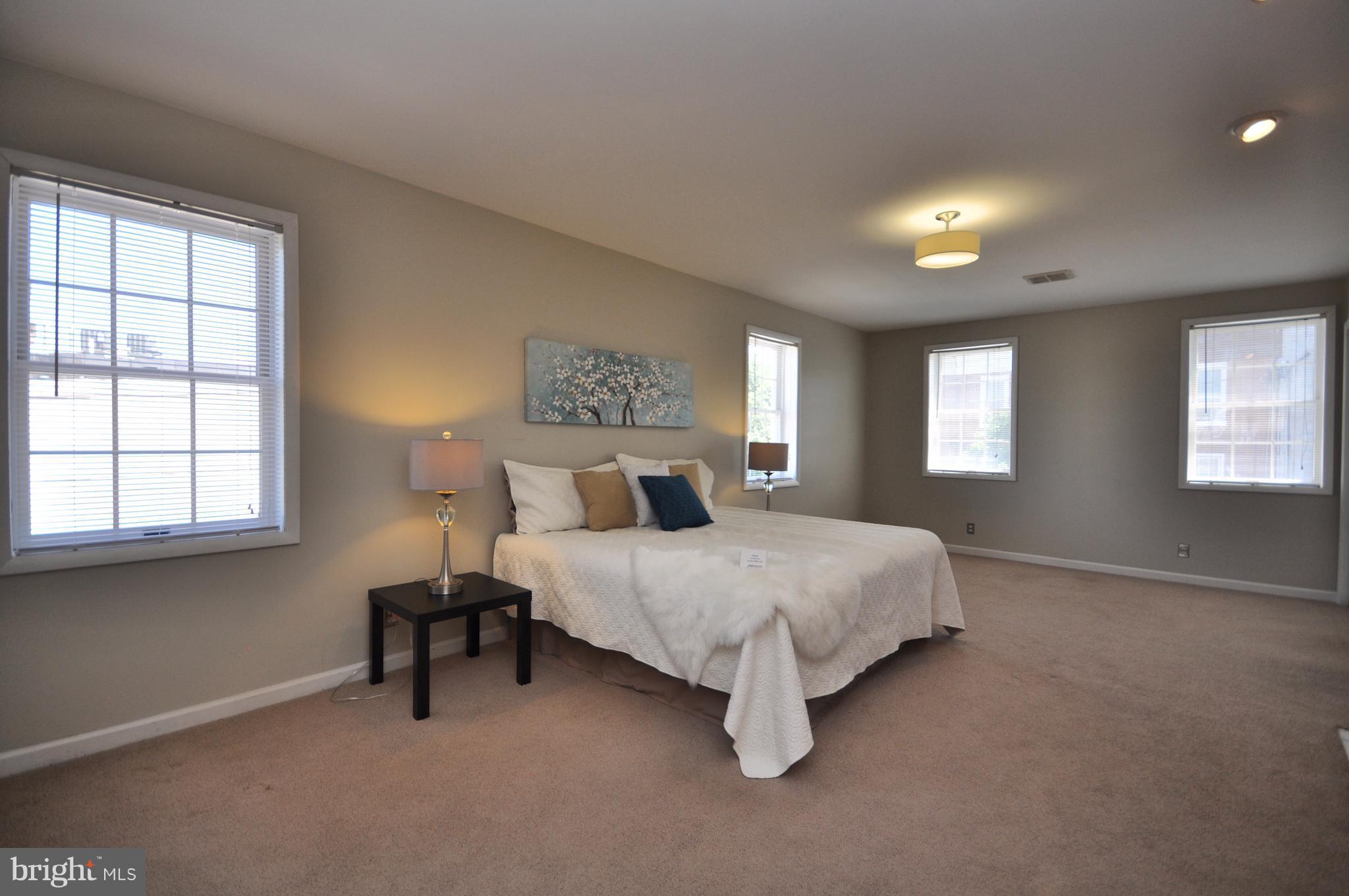 1200 Riverside Avenue Baltimore, MD 21230 - Photo 23 of 30 a spacious bedroom with a bed and window