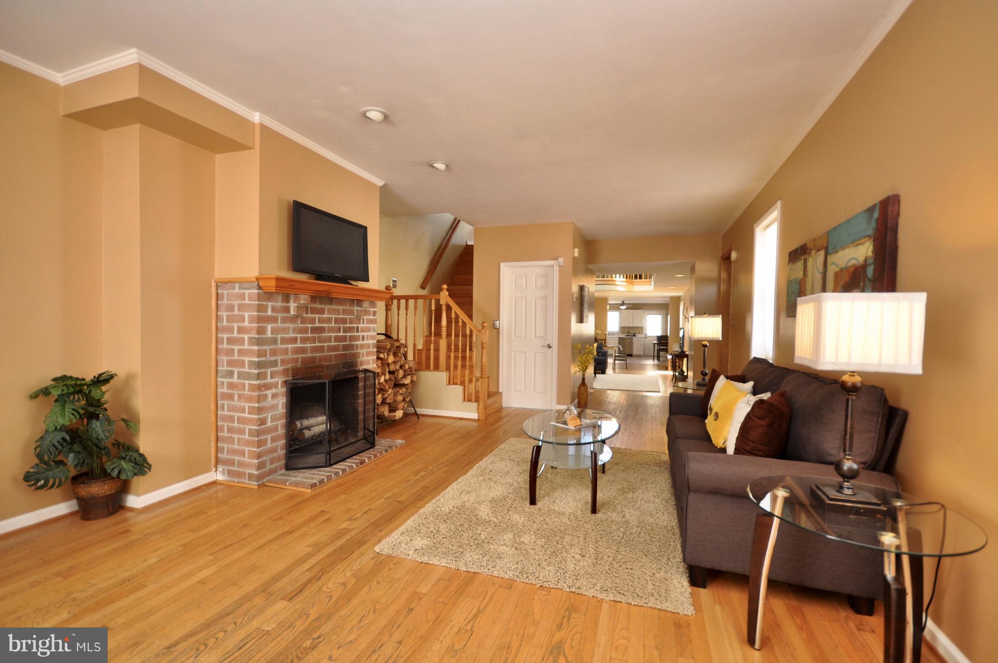 1200 Riverside Avenue Baltimore, MD 21230 - Photo 5 of 30 a living room with furniture and a fireplace