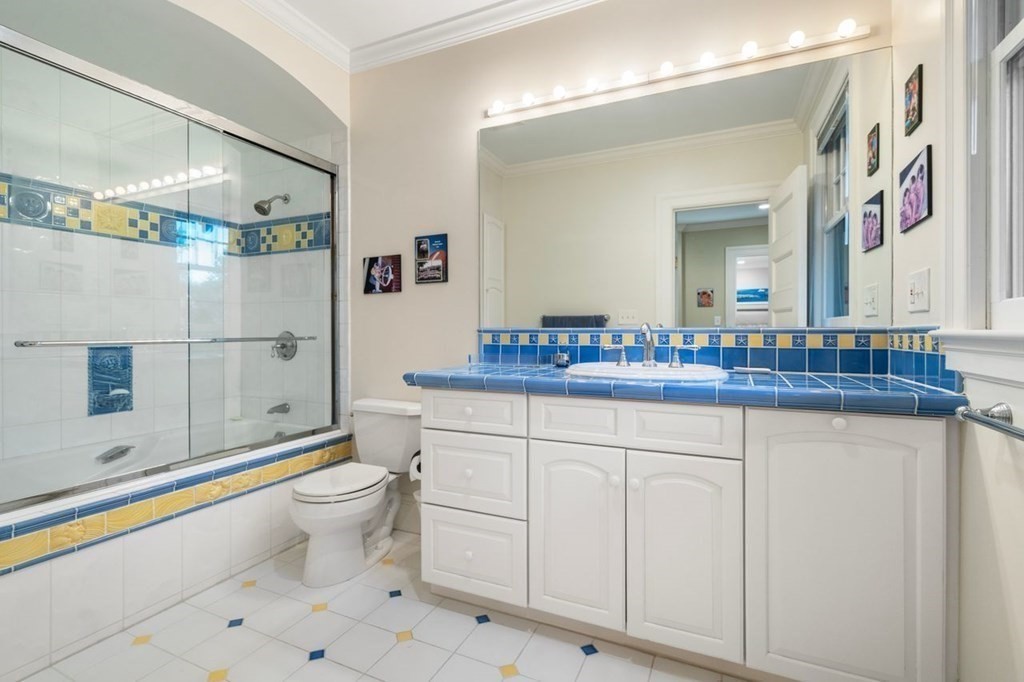 60 Abbott Road Wellesley, MA 02481 - Photo 22 of 40 a bathroom with a sink a toilet and shower