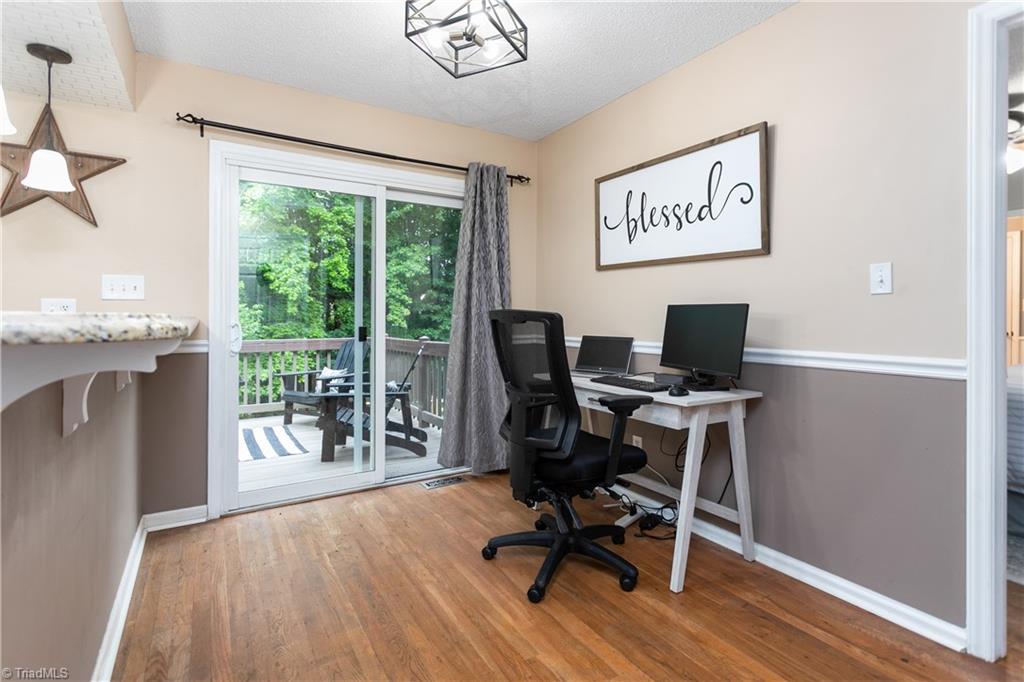 7105 Harper Ridge Court Oak Ridge, NC 27310 - Photo 11 of 23 Add a few tall counter stools for additional seating. Current breakfast nook used as home office.
