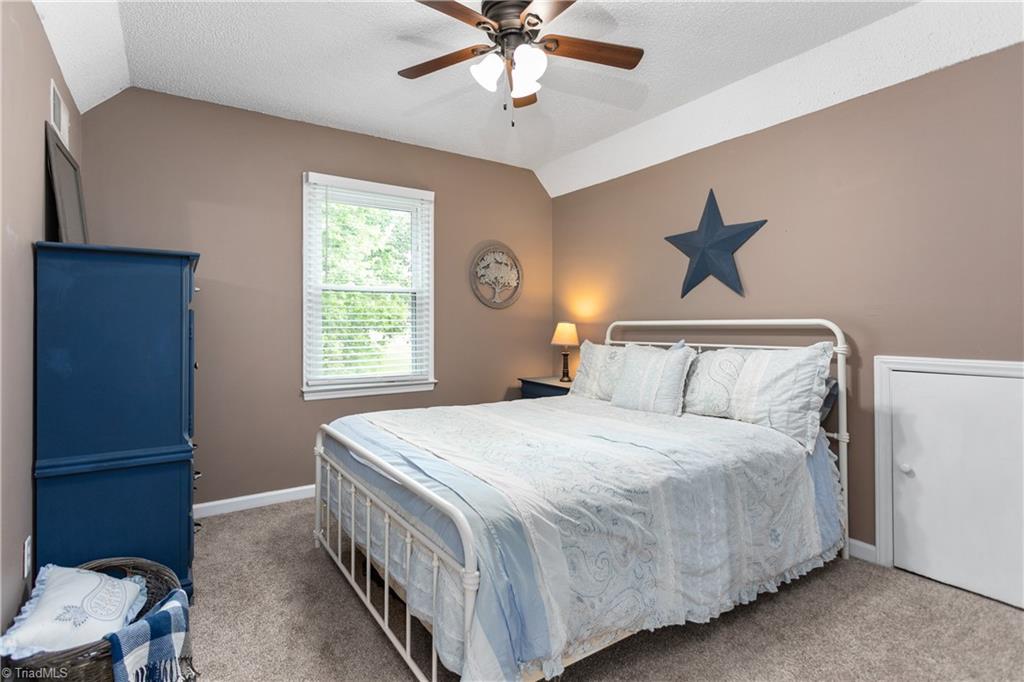 7105 Harper Ridge Court Oak Ridge, NC 27310 - Photo 17 of 23 2nd upper level bedroom. Good eve storage.