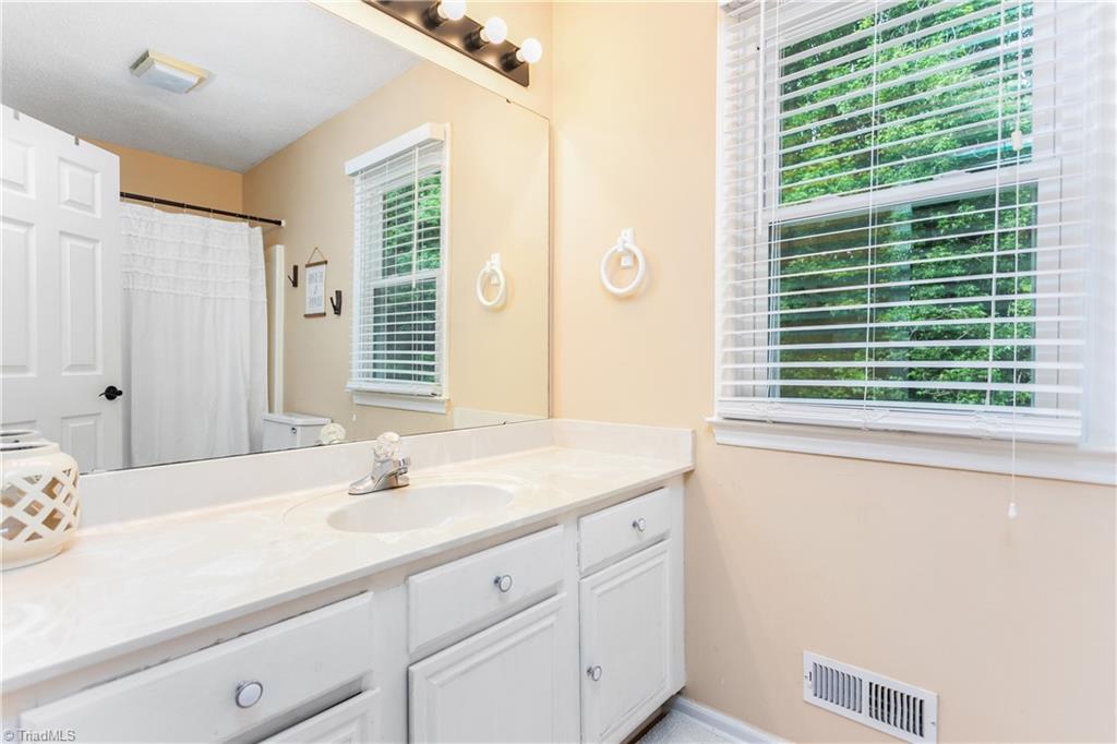 7105 Harper Ridge Court Oak Ridge, NC 27310 - Photo 18 of 23 Upper bathroom