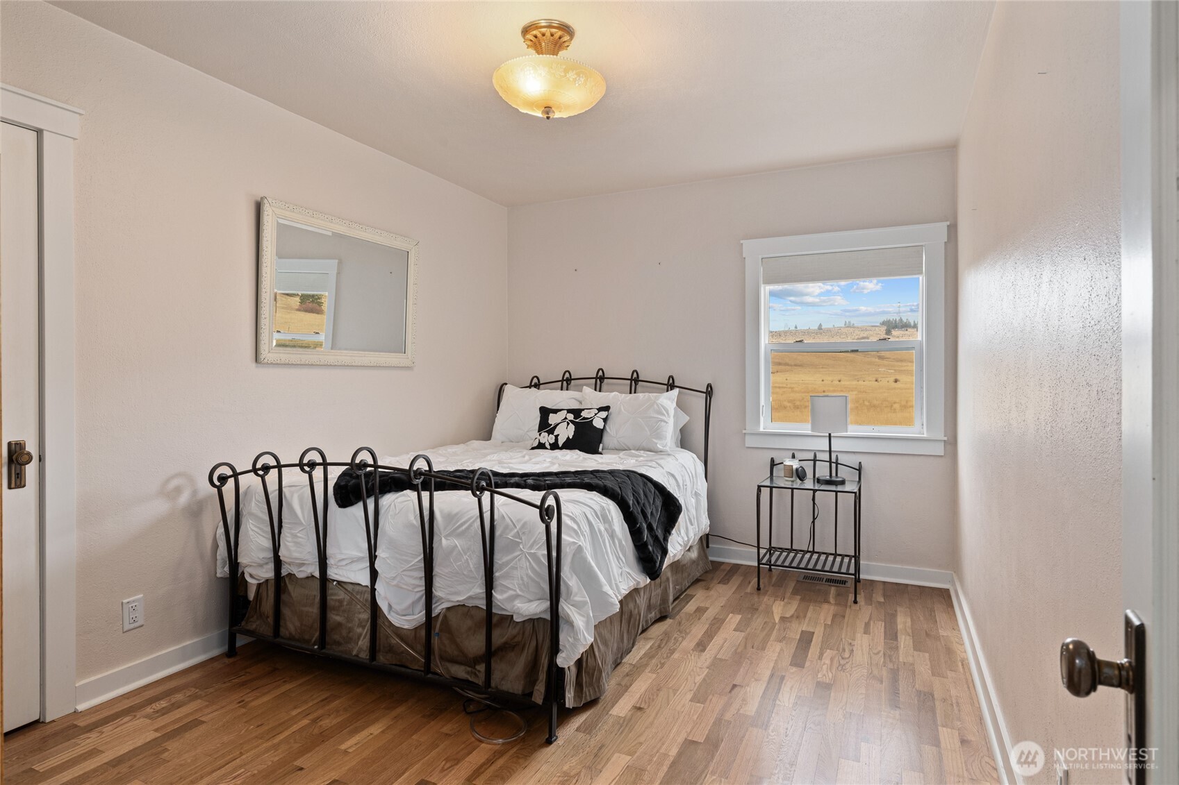 1371 Bettas Road Cle Elum, WA 98922 - Photo 19 of 40 a bedroom with a bed and wooden floor