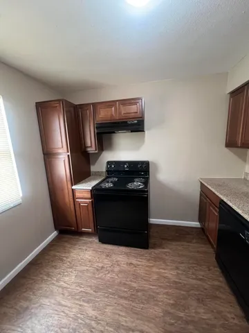 a kitchen with a stove and a refrigerator