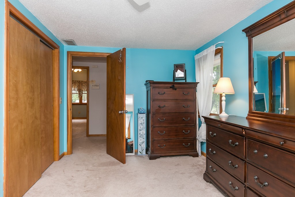 387 Maple Road Longmeadow, MA 01106 - Photo 17 of 27 a room with a dresser and a mirror