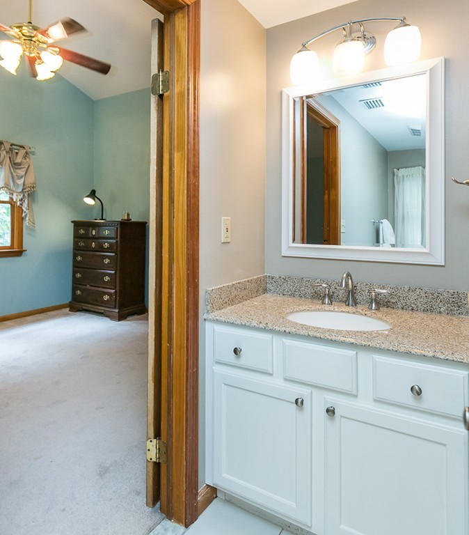 387 Maple Road Longmeadow, MA 01106 - Photo 18 of 27 a bathroom with a granite countertop sink and a mirror