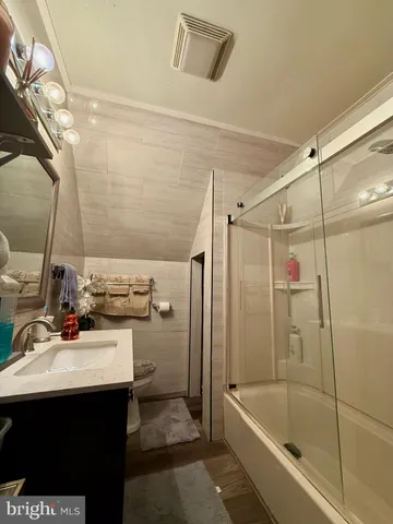 a bathroom with a sink a mirror and a bathtub