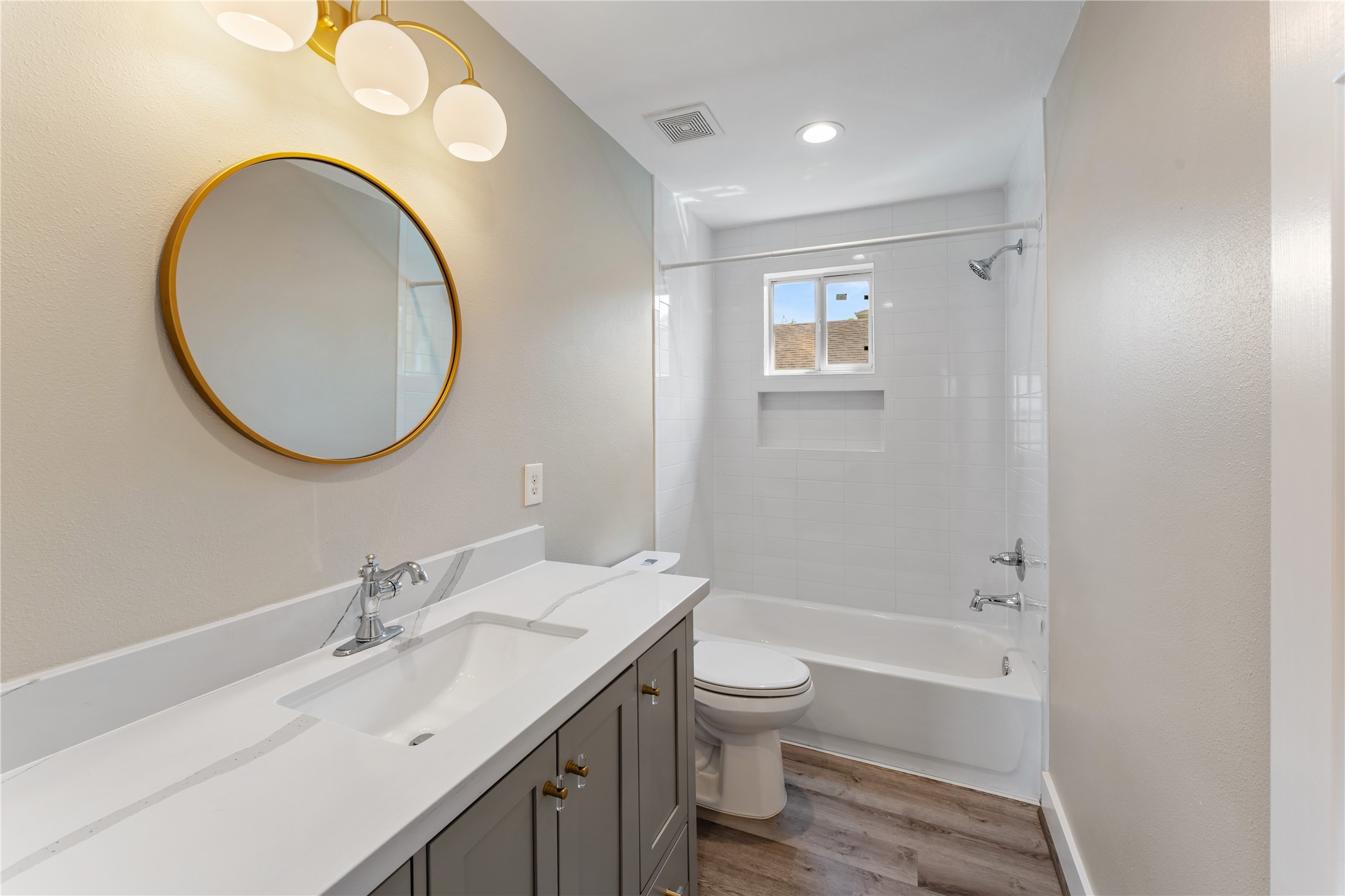809 East 40th Street Houston, TX 77022 - Photo 22 of 27 Updated with fresh finishes, this bathroom offers a clean and timeless design with modern fixtures and neutral tones. PEX plumbing beneath the home and within the guest bathroom shower wall (2021).