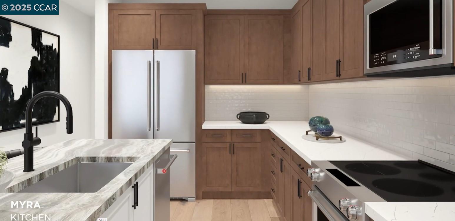 648 South Main Street Milpitas, CA 95035 - Photo 2 of 13 a kitchen with a sink stove and refrigerator