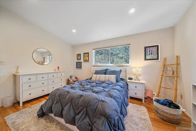 a bathroom with a sink and mirror with window