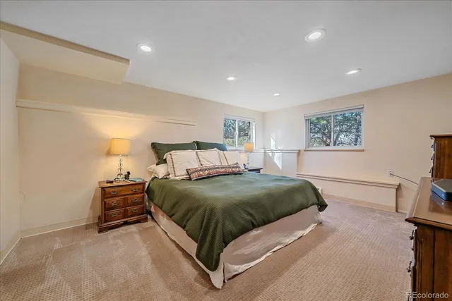 a bed room with a bed and a tv