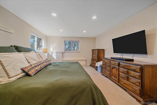 a bed room with a bed and a window