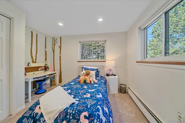 a bathroom with a granite countertop double vanity sink mirror and shower