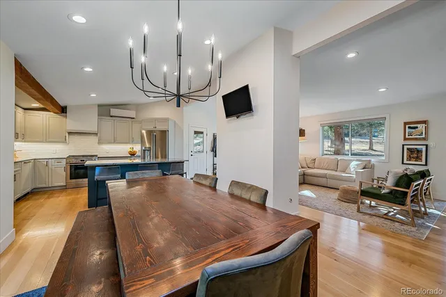 a view of balcony with chairs and wooden fence