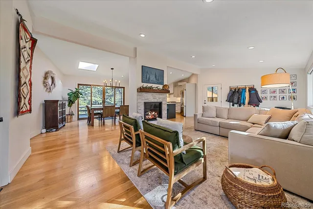 a living room with furniture fireplace and flat screen tv
