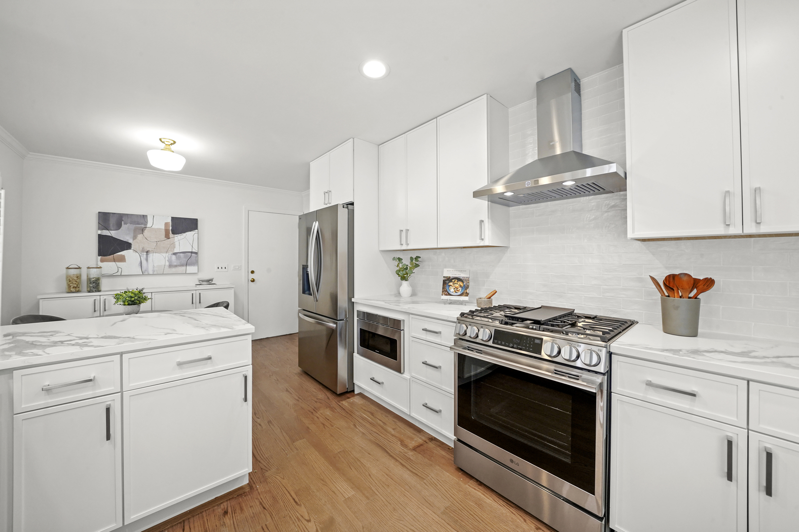 524 Forest Hill Road Lake Forest, IL 60045 - Photo 2 of 32 a kitchen with white cabinets and stainless steel appliances