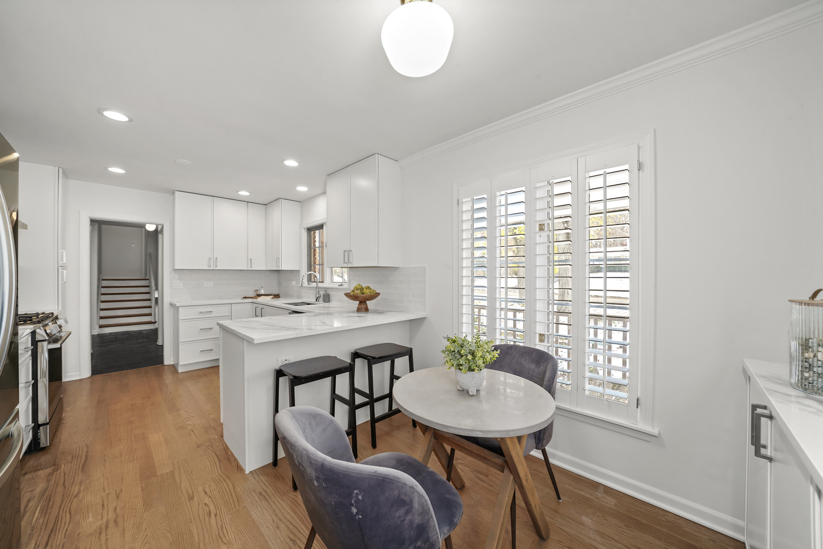 524 Forest Hill Road Lake Forest, IL 60045 - Photo 3 of 32 a kitchen with a table and chairs in it